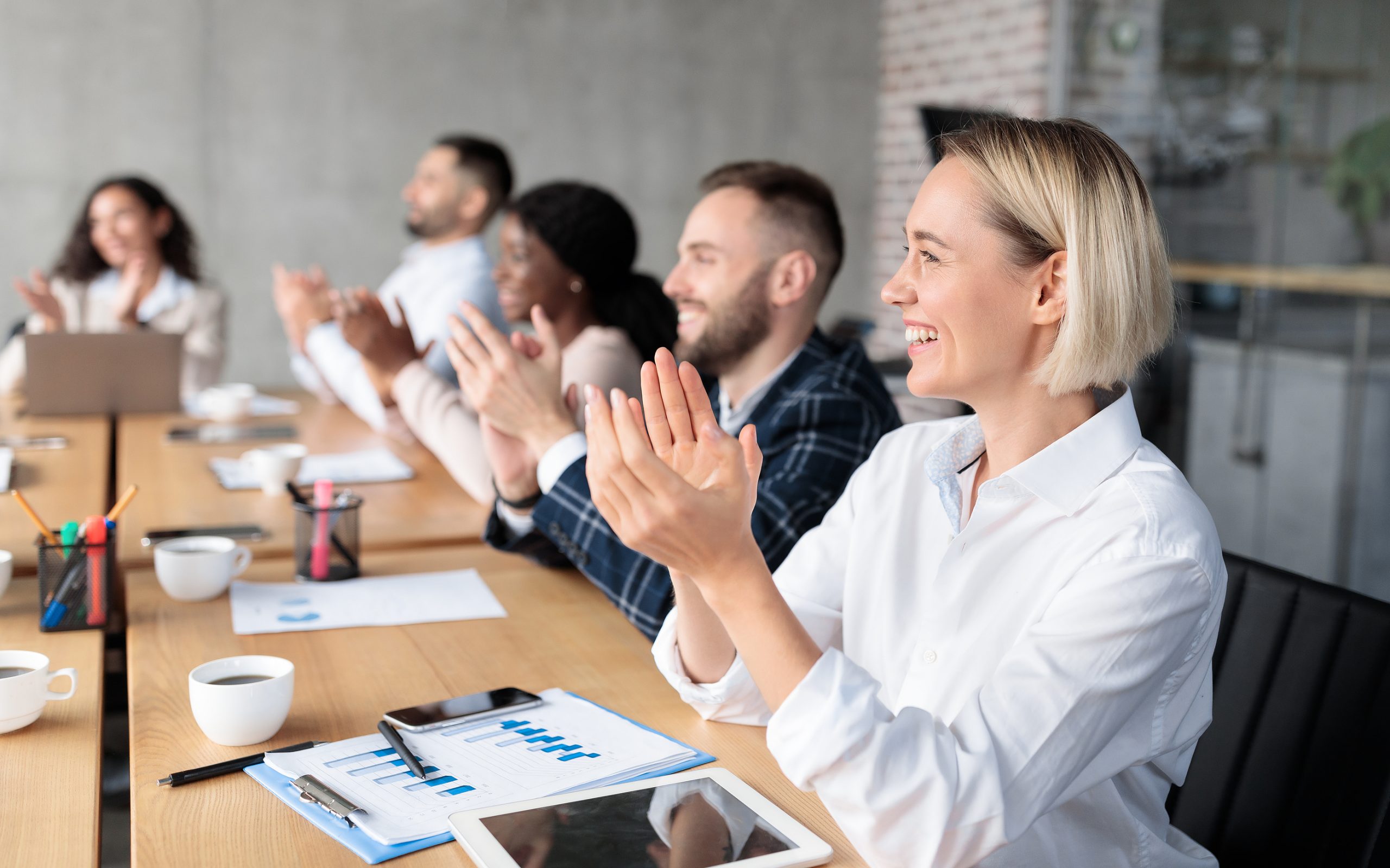 Joyful Coworkers Applauding Celebrating Business Success Sitting